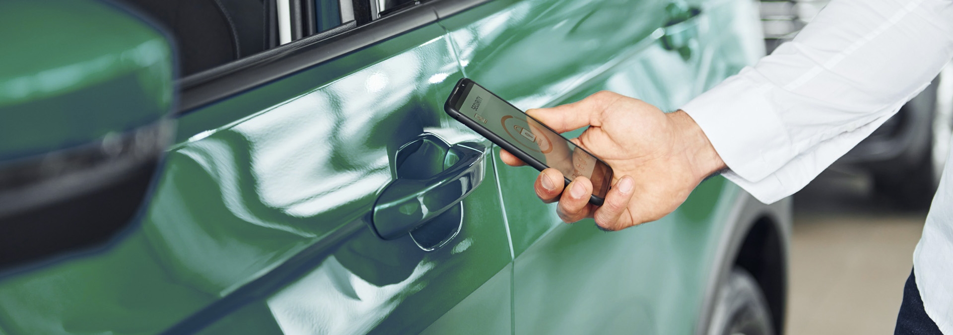 Person unlocking a car with car sharing app