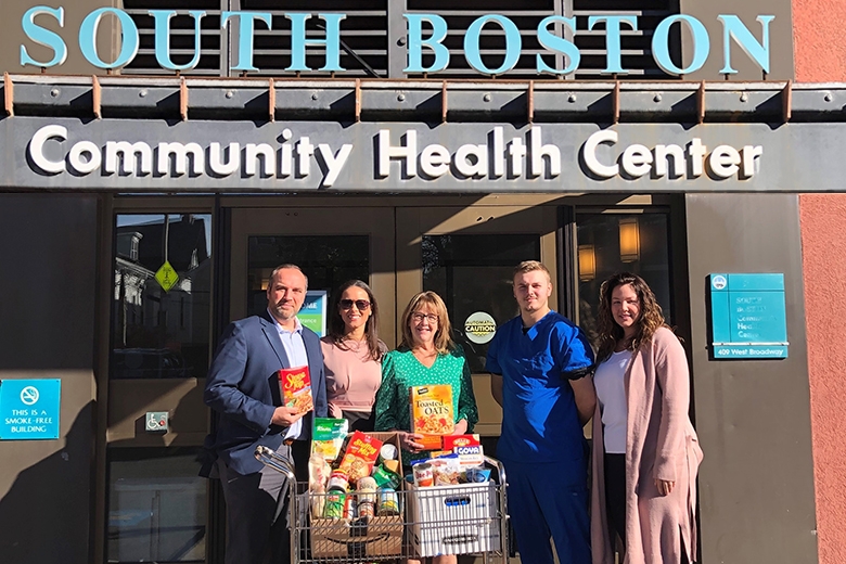 Massport employees bringing food donations to the South Boston Community Health Center