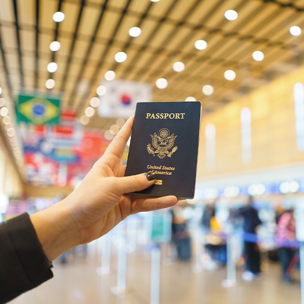 Person holding a passport in an international terminal