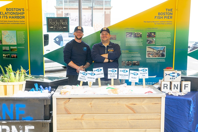 Two fisherman selling products