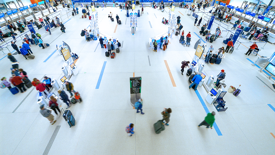 People walking around terminal C pre-security