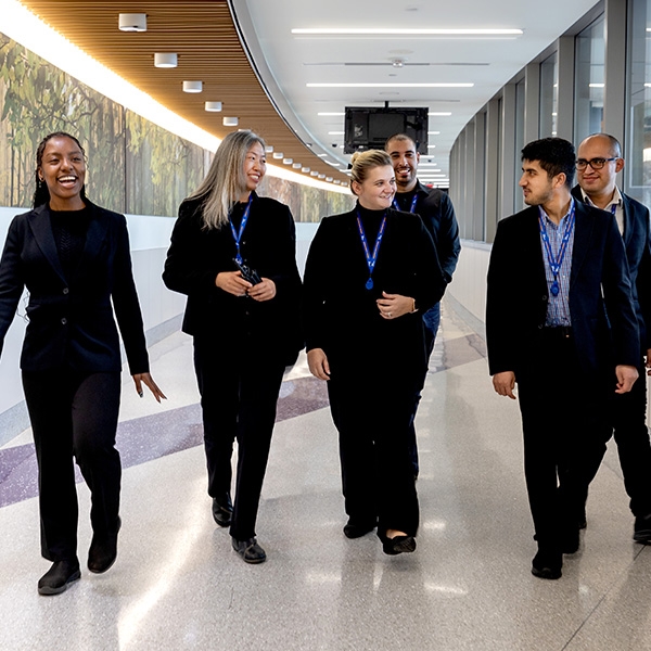 Customer Service Team walking down hallway