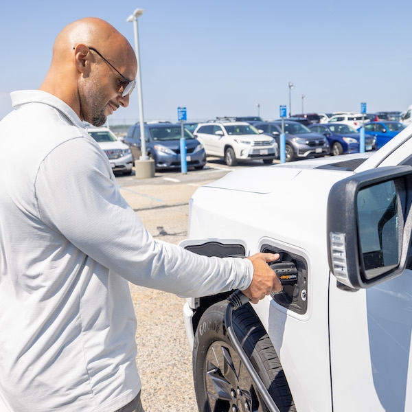 Man charging his electric vehicle 