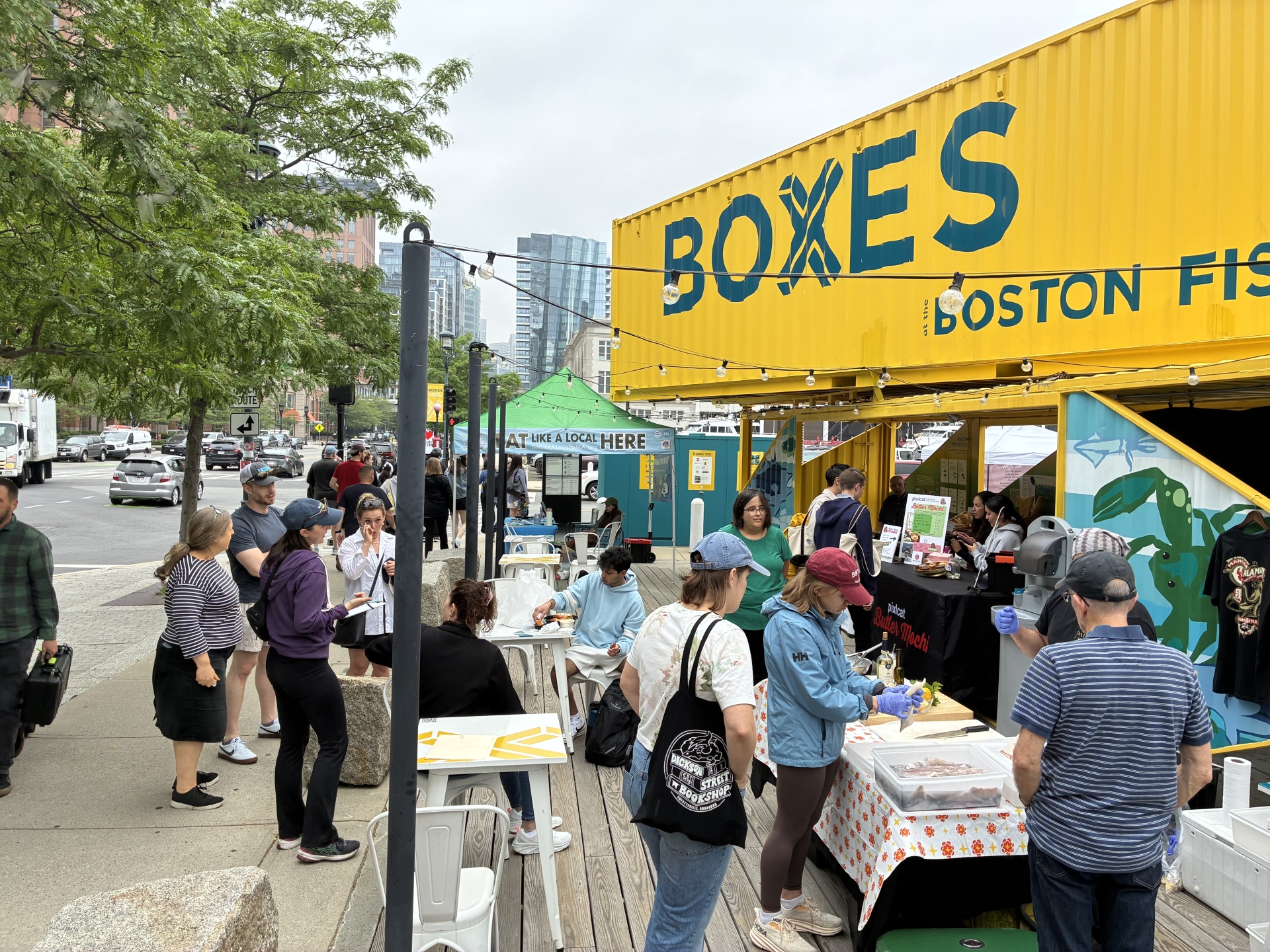 People enjoying the Fish and Farm Market at the Boxes at the Boston Fish Pier