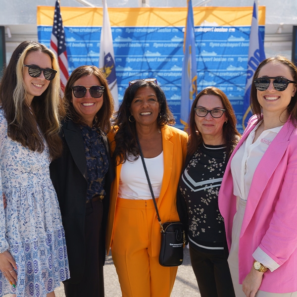 Women smiling at group of people