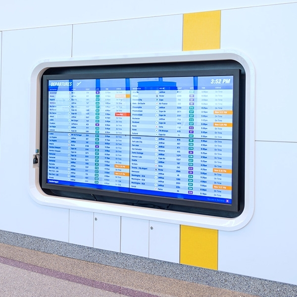 A sign showing departure times at Boston Logan International Airport