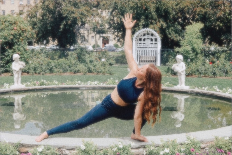 Girl doing yoga in a garden