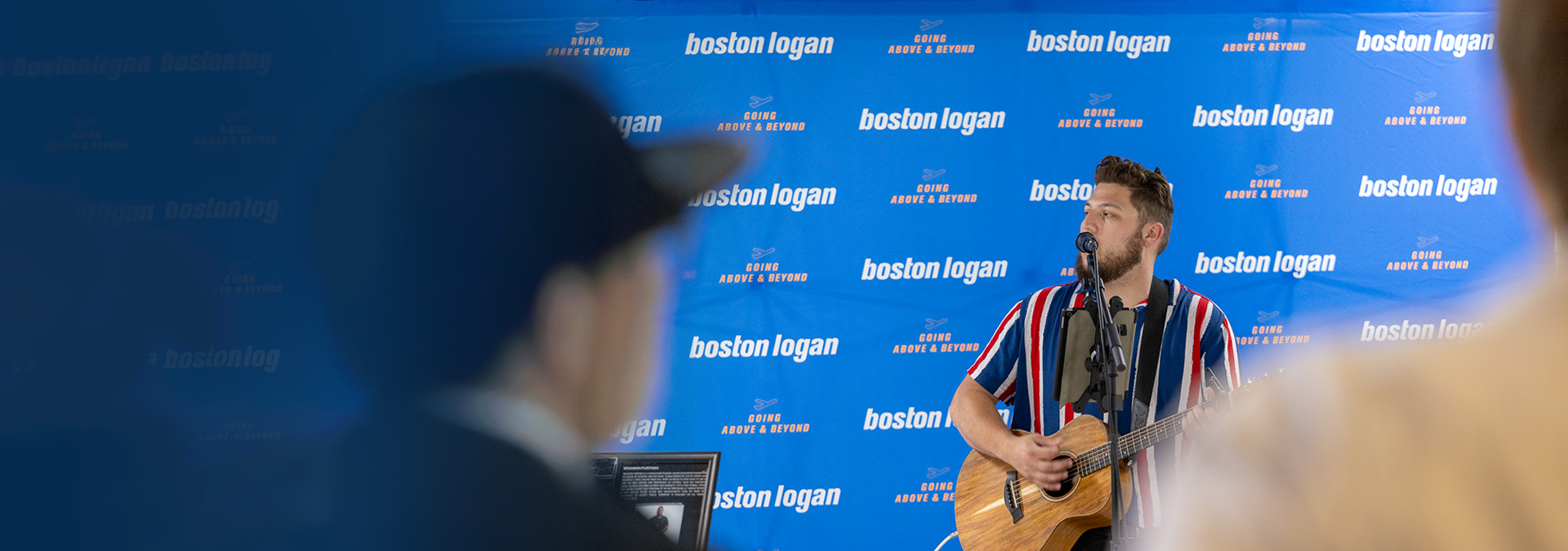 Musician singing in baggage claim