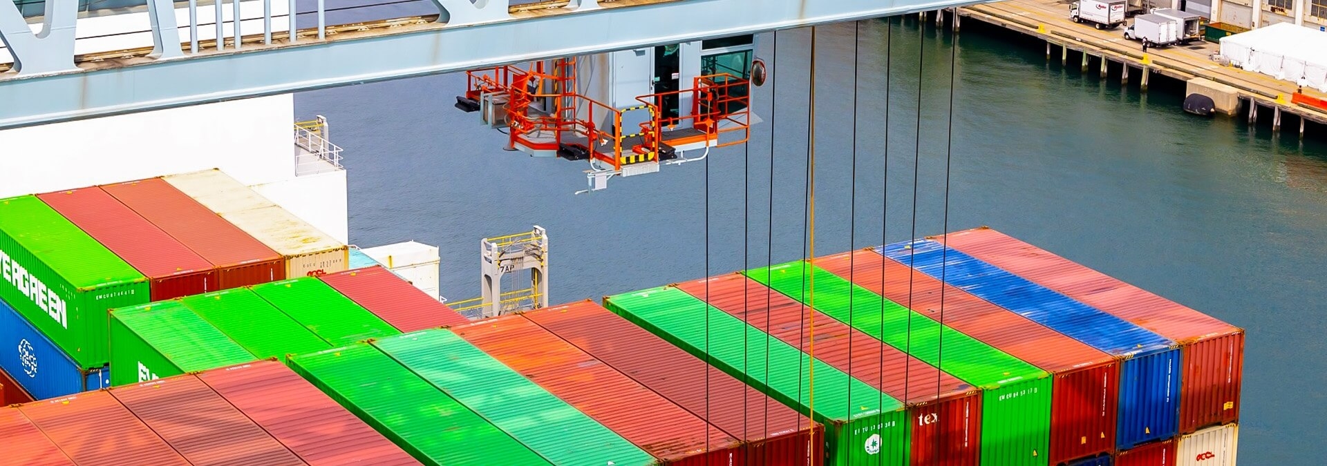 Crane unloading containers off of a ship