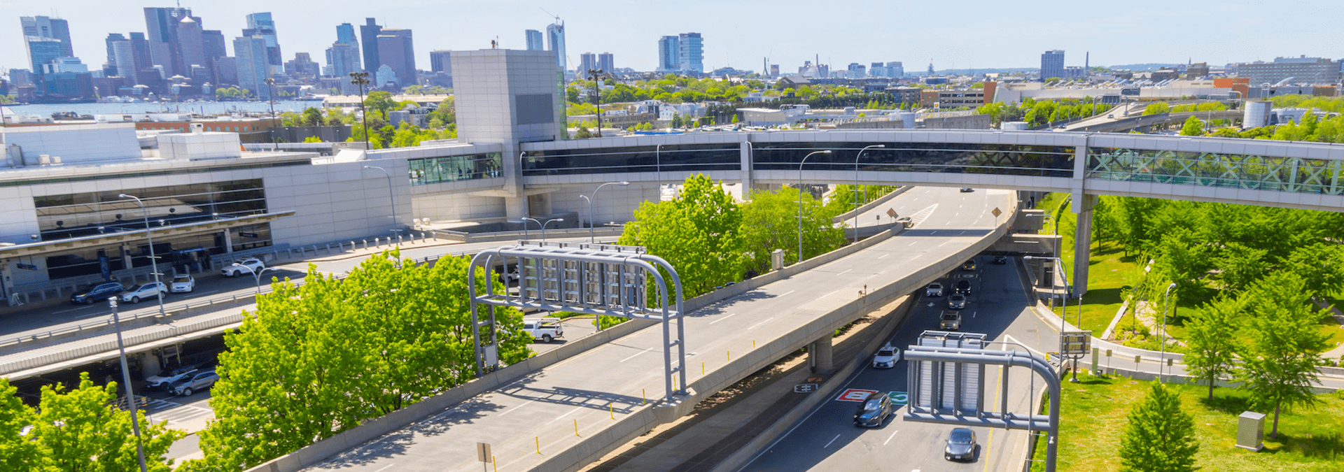Roadways at Boston Logan with city skyline in the background