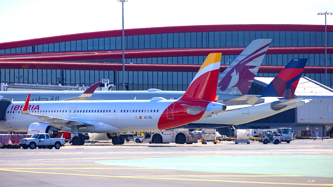 Airplanes parked on the runway in front of Terminal E