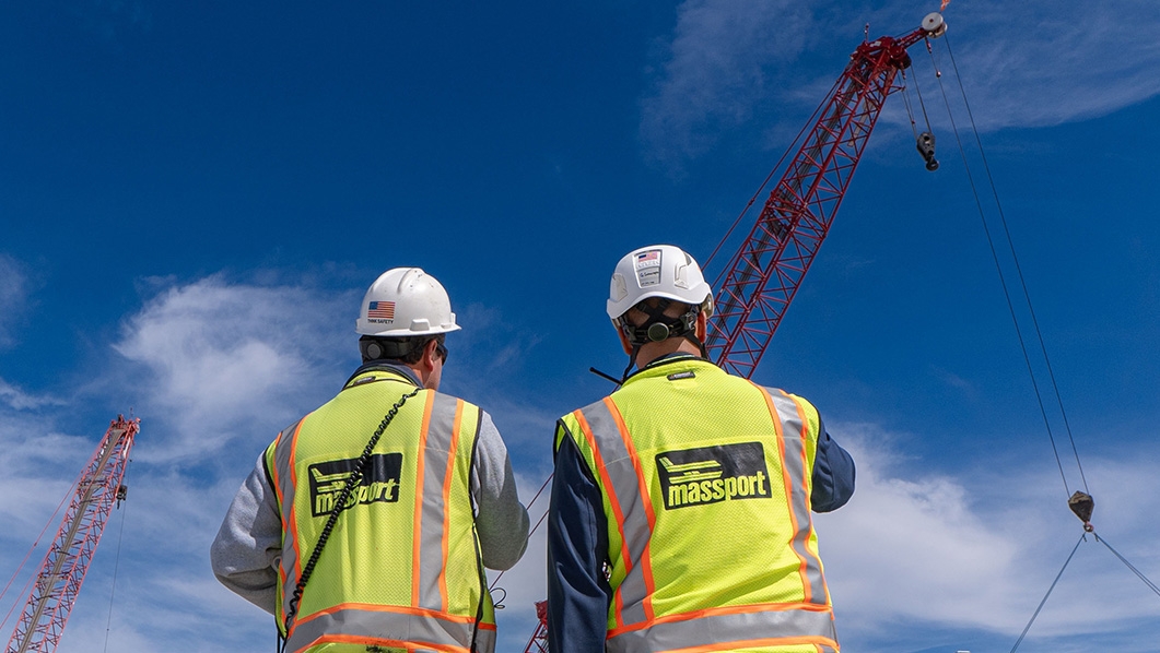 Men in construction hats and vests