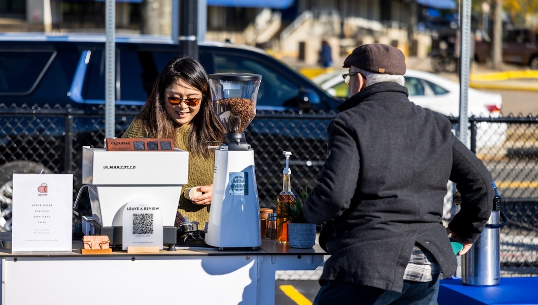 Women serving coffee in Flynn parking lot