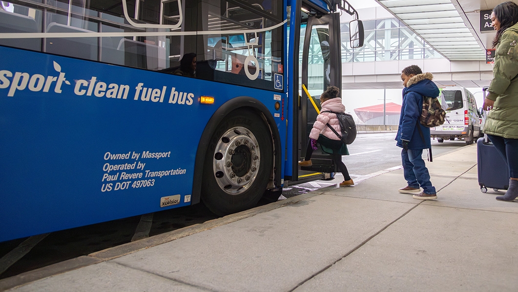 Family getting on Airport Shuttle
