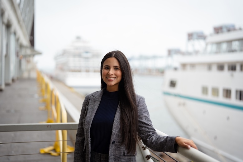 Flynn Cruiseport Employee standing in front of ship
