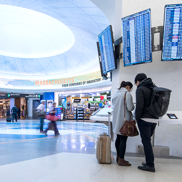 Passengers at Logan at info kiosk